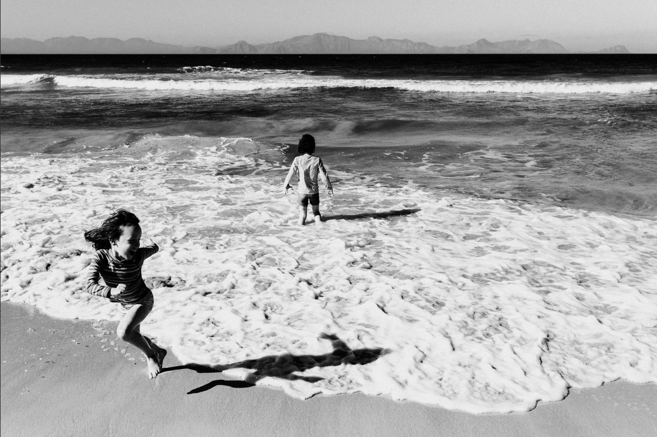 Two people together at the water's edge